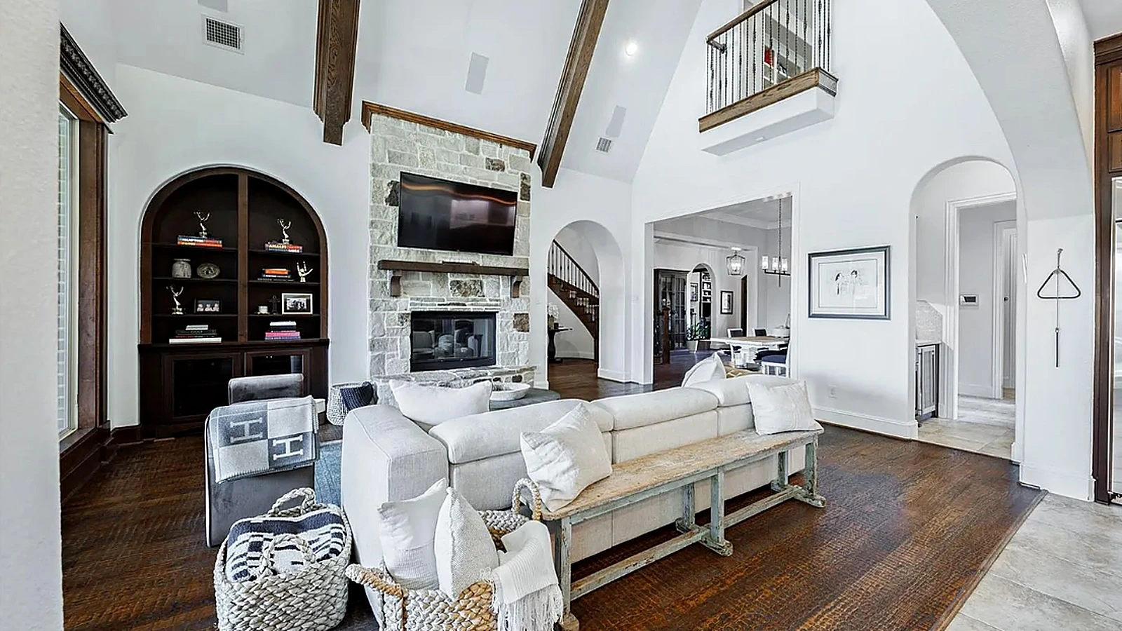 Open great room with arched openings to kitchen and dining in renovated Bellaire Houston interior