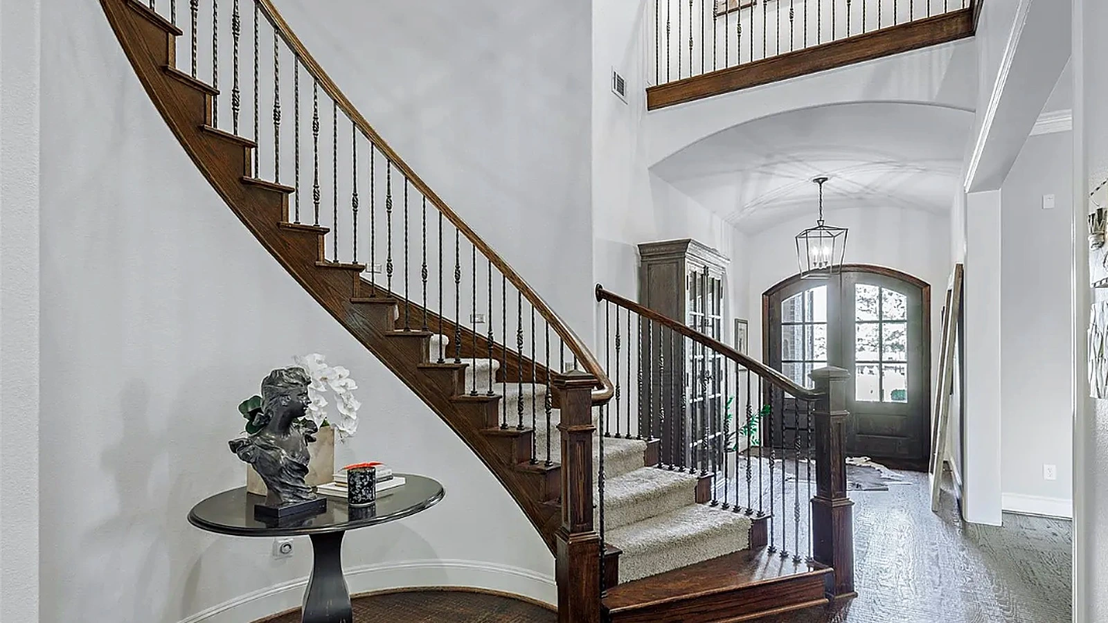 Great room rear glazed doors and outdoor patio connection in Bellaire whole-home renovation Houston TX