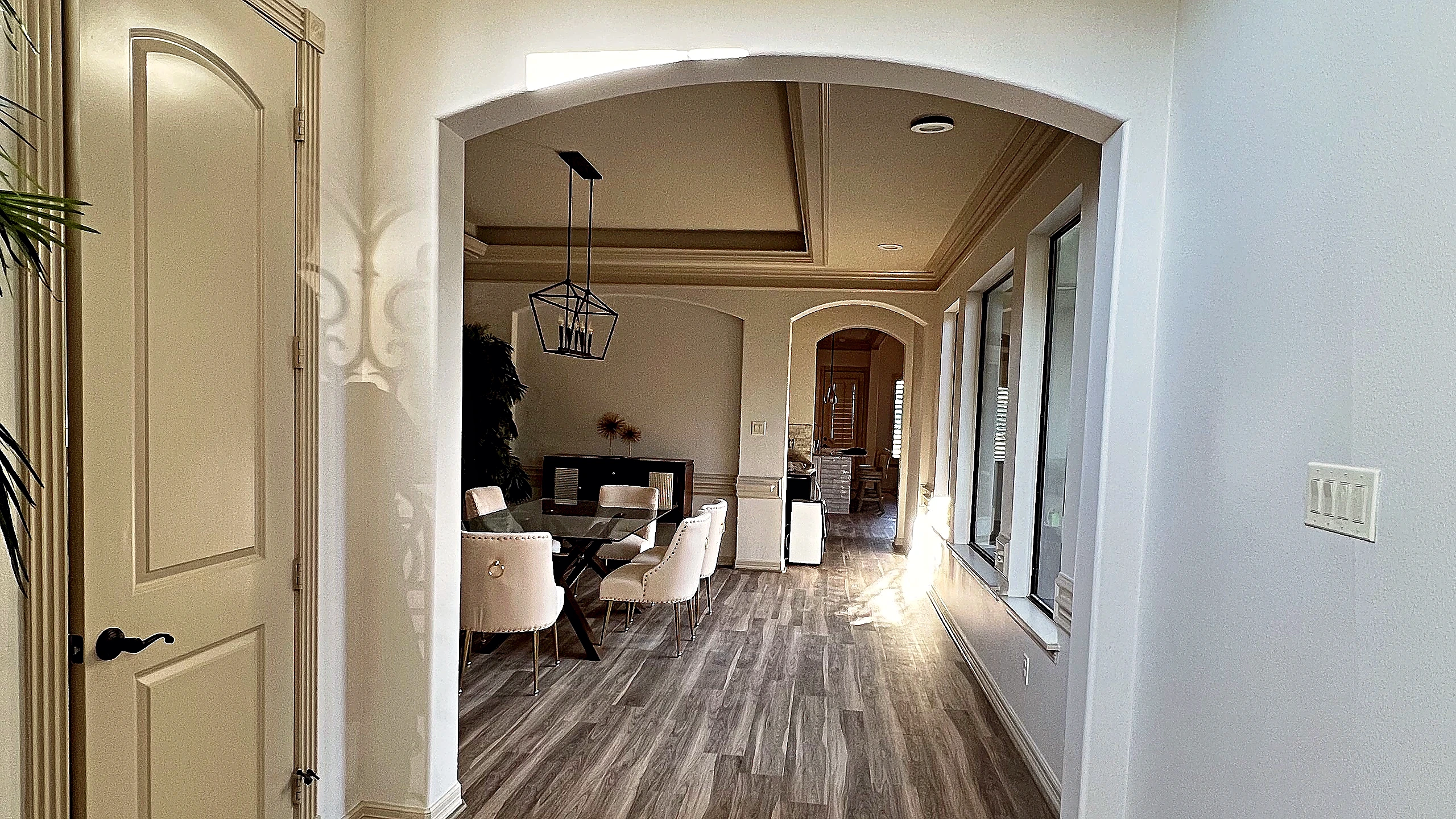 Floor-to-ceiling stacked natural stone fireplace in double-height living room, Tomball TX